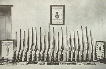 Here are 19 of the 23 guns in the Winchester exhibit that toured the country in the spring of 1909. This photograph was taken while the collection was in Milwaukee. From Outers Book, August, 1909.